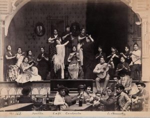 Vintage photo of flamenco performers on stage at a café.