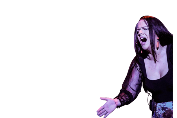 Woman singing passionately, wearing a black top, expressive gesture.